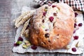 Homemade mixed fruit and nut white bread on wooden table