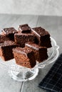 Homemade Moist Chocolate Sponge Cake Brownie Pieces in Vintage Glass Dessert Stand. Royalty Free Stock Photo