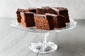 Homemade Moist Chocolate Sponge Cake Brownie Pieces in Vintage Glass Dessert Stand. Royalty Free Stock Photo