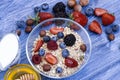 Homemade muesli or granola in bowl with milk, honey, berries and nuts. healthy breakfast. top view. Delicious healthy Royalty Free Stock Photo