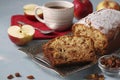 Homemade muffin with semolina, apples and raisins on a metal tray on a light blue background and cup of coffee Royalty Free Stock Photo