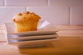 Homemade muffin on stank of white plates with low key lighting Royalty Free Stock Photo