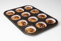 Homemade muffins with chocolate crumbles in baking dish