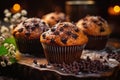 Homemade muffins with chocolate on top of the wooden table