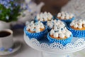 Homemade muffins with whipped cream and a flower