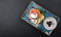 Homemade muffins with yogurt, blueberry, apple and jam in plate on dark stone background. Healthy breakfast Royalty Free Stock Photo