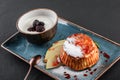 Homemade muffins with yogurt, blueberry, apple and jam in plate on dark stone background. Healthy breakfast Royalty Free Stock Photo