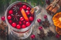 Homemade mulled wine with orange slices, cranberries, cinnamon and anise