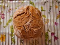 Homemade multi grain sourdough bread on the cooling rack on the table in the kitchen