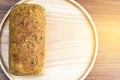 Homemade multigrain bread loaf on wood table