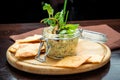 Homemade mushroom and bean paste. Pate in glass jar on rustic wooden table.