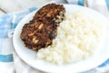 Homemade mushroom cutlets with rice porridge on wooden background Royalty Free Stock Photo