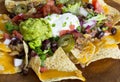 Homemade Nachos with tortilla chips cheese and guacamole