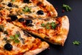 Homemade Napoli Pizza or anchovies pizza on black slate stone