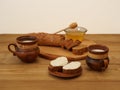 Homemade natural dairy products served with honey and toast for breakfast. Earthenware on a wooden background. Nicely