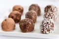 Homemade natural vegan chocolate truffle with cacao on white plaHomemade natural vegan chocolate truffle with cacao Royalty Free Stock Photo