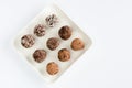 Homemade natural vegan chocolate truffle with cacao on white plate Royalty Free Stock Photo