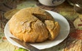 Homemade newly-baked bread on the kitchen table Royalty Free Stock Photo