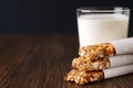 Homemade no bake granola bars with glass of milk on rustic wooden table. Royalty Free Stock Photo