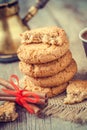 Homemade oat cookies, cinnamon sticks and coffee