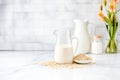 homemade oat milk in a glass pitcher on a marble slab Royalty Free Stock Photo