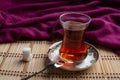 A cup of tea with sugar on wooden background Royalty Free Stock Photo