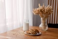 Homemade oatmeal cookies with oats, eggs and flour free on brown dark wooden table, side view. Royalty Free Stock Photo