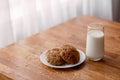 Homemade oatmeal cookies with oats, eggs and flour free on brown dark wooden table, side view. Royalty Free Stock Photo