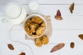 Homemade oatmeal cookies with raisins and prunes with jug and glass of milk on white wooden background. No sugar, no flour Royalty Free Stock Photo