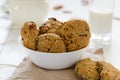 Homemade oatmeal cookies with raisins and prunes with jug and glass of milk on white wooden background. No sugar, no flour Royalty Free Stock Photo