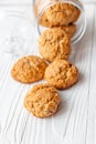 Homemade oatmeal cookies on white wooden table with milk on background Royalty Free Stock Photo