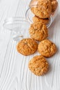 Homemade oatmeal cookies on white wooden table with milk on background Royalty Free Stock Photo