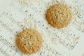 Homemade oatmeal cookies on vintage music sheet Royalty Free Stock Photo