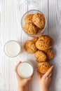 Homemade oatmeal cookies on white wooden table with milk on background Royalty Free Stock Photo