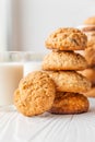 Homemade oatmeal cookies on white wooden table with milk on background Royalty Free Stock Photo