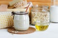 Homemade oatmeal mask in a glass jar. Gentle scrub for sensitive skin. Royalty Free Stock Photo