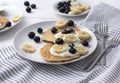 Homemade oatmeal pancakes with yogurt, fresh blueberry and banana at white wooden background Royalty Free Stock Photo