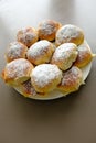 Homemade old fashioned apple dumplings or pies on a white plate and brown background. Baked according to Ukraine recipe. Royalty Free Stock Photo