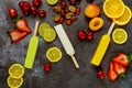 Homemade orange, coconut and lime popsicles on dark background Royalty Free Stock Photo