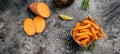 Homemade Orange Sweet Potato Fries with lime and herbs, Long banner format. top view Royalty Free Stock Photo