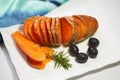 Homemade Orange Sweet Potato with olives and rosemary