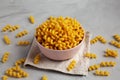 Homemade Organic Dried Riccioli Pasta in a Pink Bowl, side view