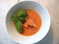 Homemade Organic homegrown Heirloom tomato soup with crouton and fresh basil