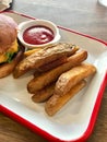 Homemade Organic Potato Wedges with Ketchup served Hamburger Plate Tray at Fast Food Restaurant