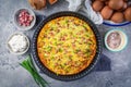 Homemade oven baked frittata with curd cheese, bacon, onion and chives Royalty Free Stock Photo