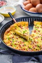 Homemade oven baked frittata with curd cheese, bacon, onion and chives Royalty Free Stock Photo