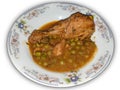 Homemade Pakistani chicken curry with pea in traditional plate