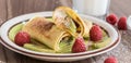 Homemade pancake with vanilla curd, raspberries, kiwi and banana pieces sprinkled with cocoa Royalty Free Stock Photo