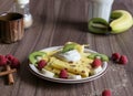 Homemade pancake with vanilla curd, raspberries, kiwi and banana pieces sprinkled with cocoa Royalty Free Stock Photo