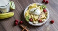 Homemade pancake with vanilla curd, raspberries, kiwi and banana pieces sprinkled with cocoa Royalty Free Stock Photo